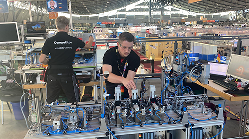 Team from Germany working on a machine in competition
