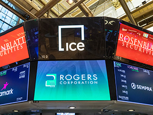 nyse screens with rogers corporation logo featured